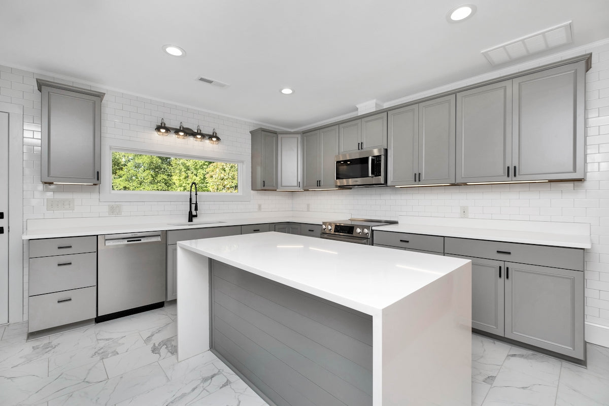 a kitchen with white cabinets