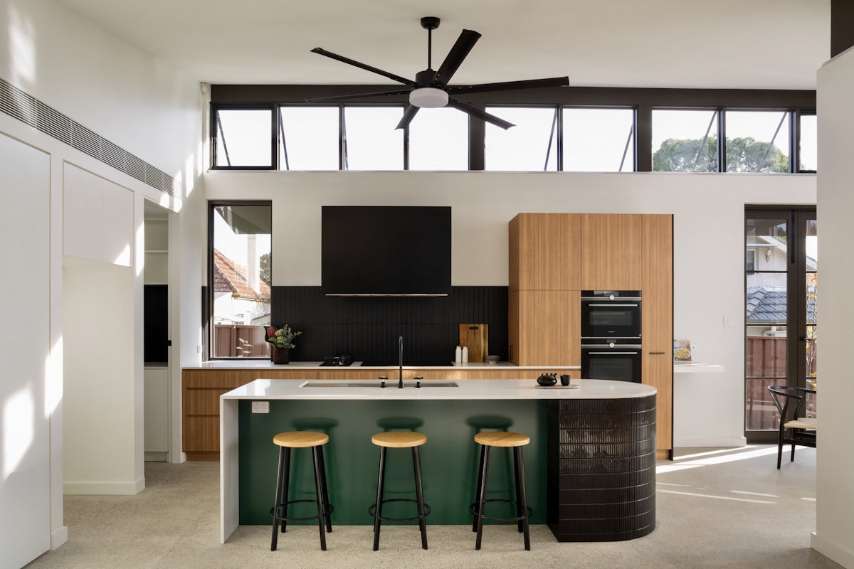 a kitchen with a bar stools