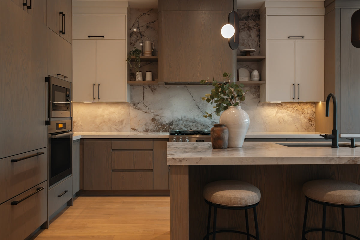 Modern kitchen with island and pendant light.