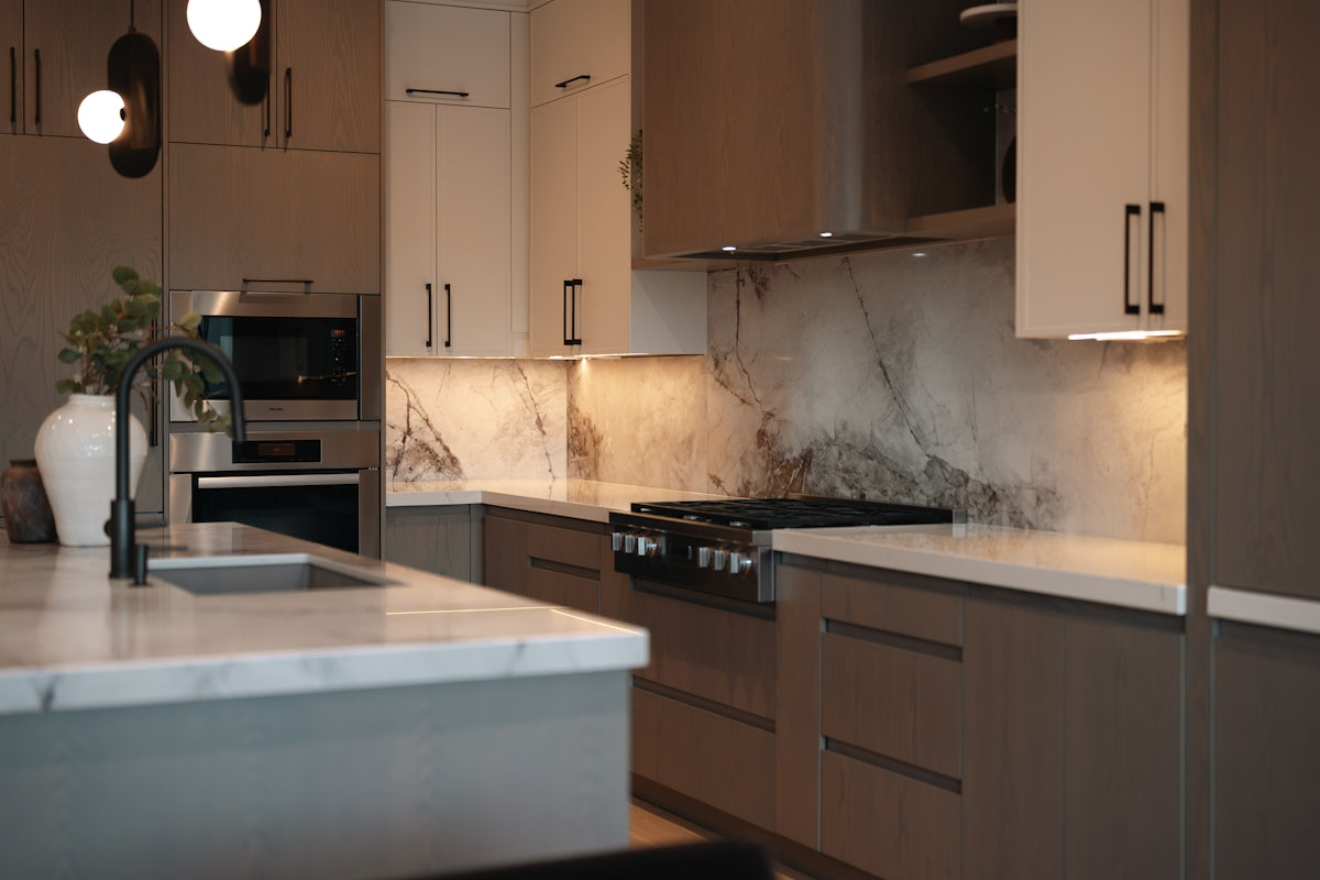 Modern kitchen with marble countertops and sleek cabinetry