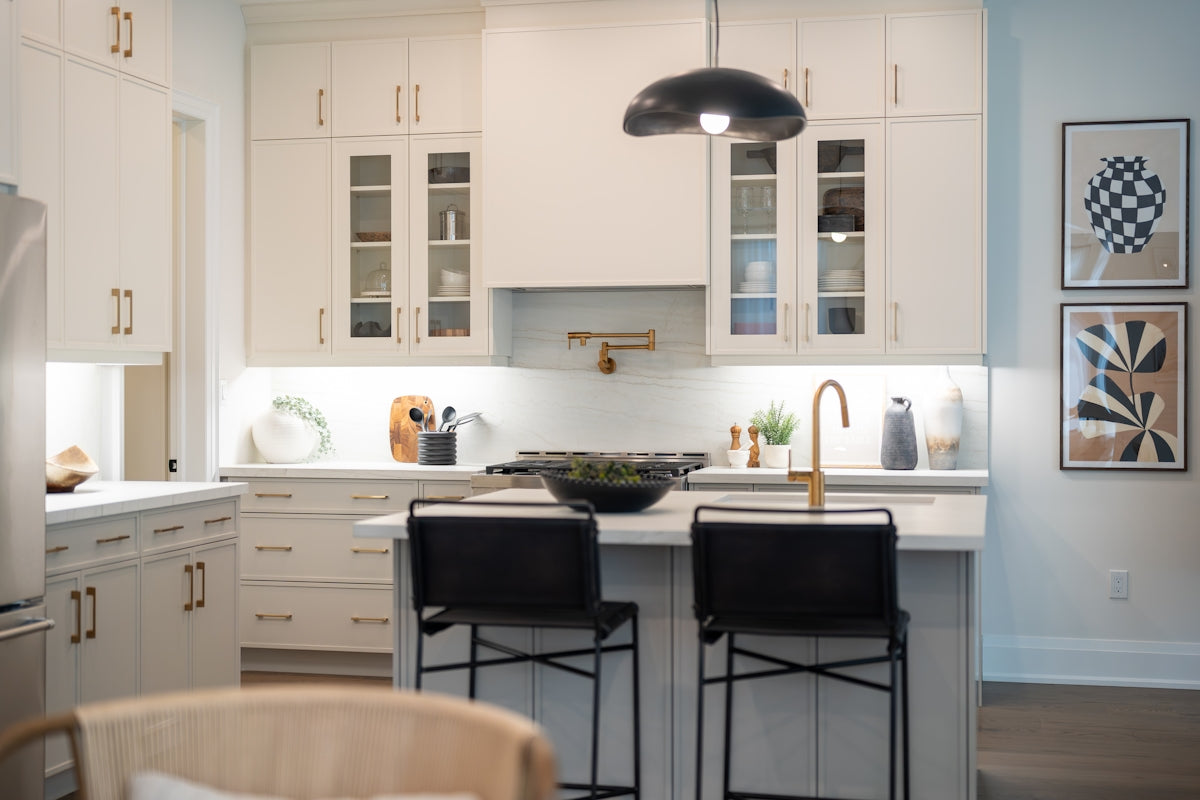 Modern white kitchen with island and bar stools