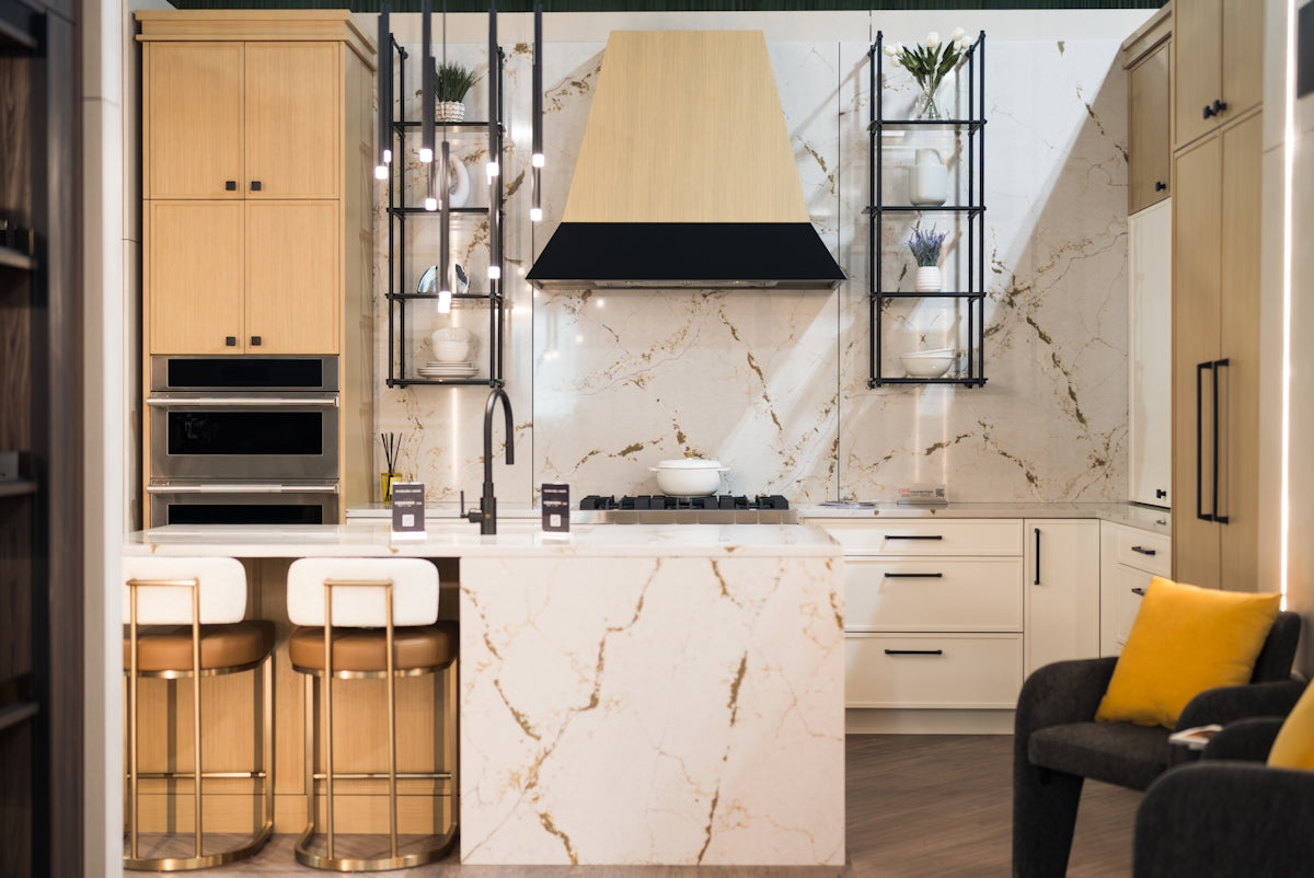 Modern kitchen with marble island and pendant lights